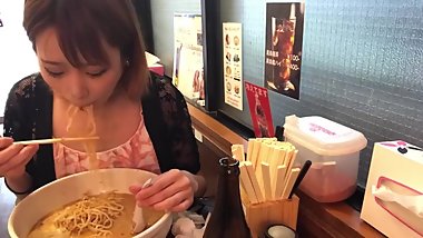 japanese girl stuffing belly