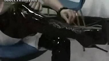 Chinese thigh high PVC black boots posing