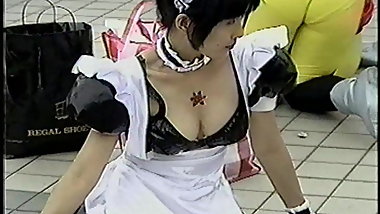 Japanese cosplay girl shows off her cleavage (not so big)