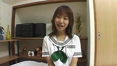 Delicate asian playing in bed