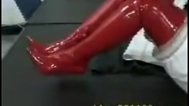 Chinese thigh high PVC red boots posing