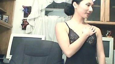 Asian skank cuts her stocking and toy masturbates